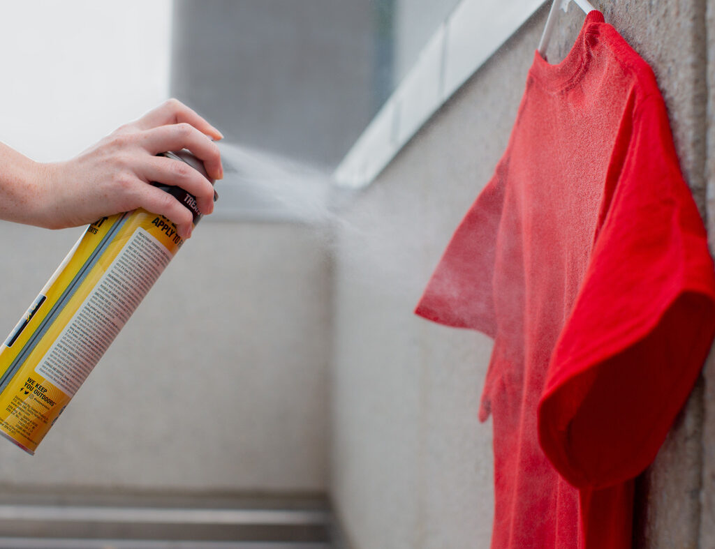 Applying Repellent to Clothing