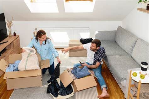 A man and his wife cleaning their home to prepare for pest control